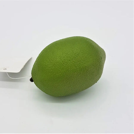 A vibrant green textured artificial fruit lime with a small black stem made of durable plastic for decoration