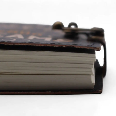 Dark brown leather notebook with brass clasp and embossed gold lettering printed leather notebook 7 by 5 inches