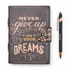 Dark gray leather notebook with gold and cream printed lettering never give up on your dreams and vintage clasp