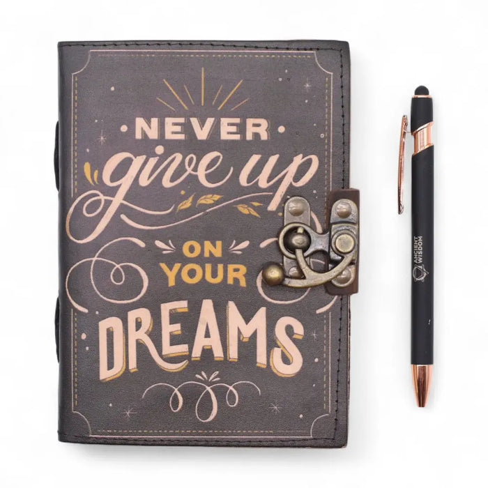 Dark gray leather notebook with gold and cream printed lettering never give up on your dreams and vintage clasp