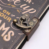 Antique brass anchor clasp on a dark leather notebook printed leather notebook 7x5 with never give up on your dreams design