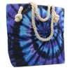 A vibrant blue and purple tie-dye canvas psychedelic splash bag with thick cream rope handles called deep dive