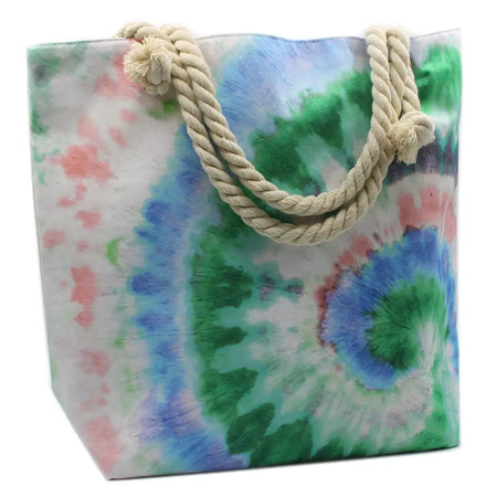 A vibrant psychedelic splash bag in tie-dye with cream twisted rope handles for a casual beach vibe