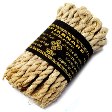 Beige twisted rope incense labeled spikenard nepali rope incense with gold lettering on black band for incense ropes