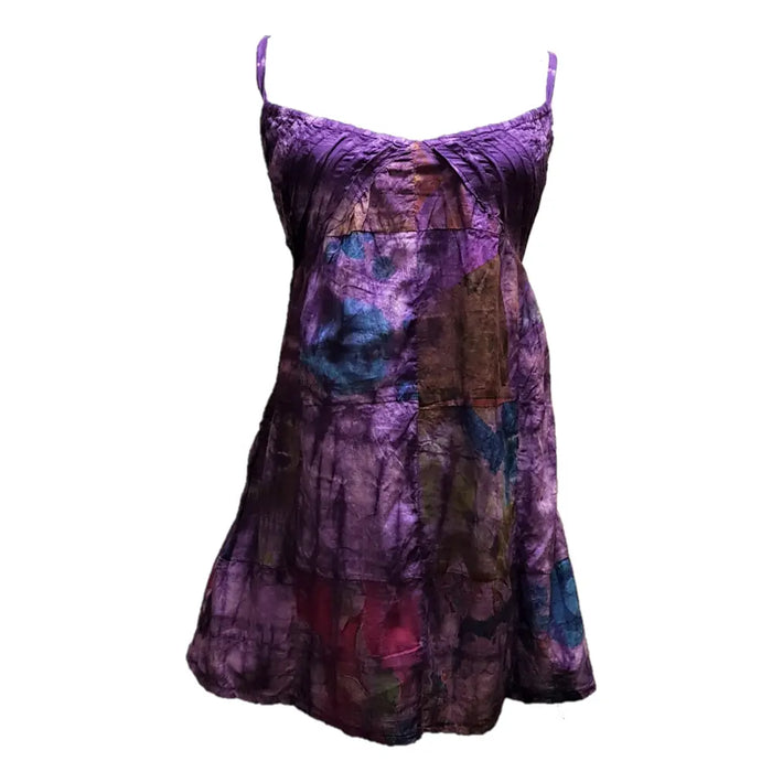 A purple tie-dye sundress with patchwork cotton fabric and spaghetti straps featuring a flared skirt design