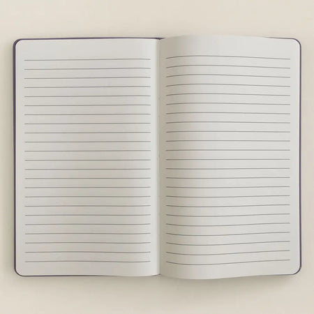 Open notebook with lined pages and a dark purple velvet cover from the purple velvet notebook 80 pages create magic series