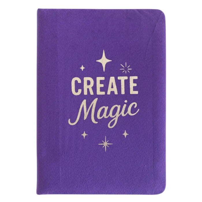 Purple velvet notebook with gold foil create magic lettering and star accents on a textured velvet cover