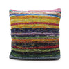 A multicolored woven rag rug cushion cover with sunrise oranges and earth tones featuring indian rag rugs design