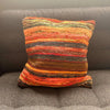 Vibrant handwoven rag rug cushion cover sunrise oranges with textured horizontal stripes in orange red yellow dark tones