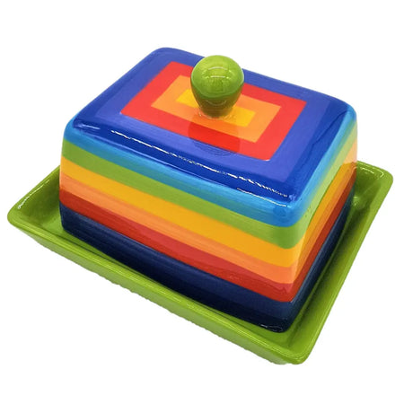 Vibrant rainbow striped ceramic butter dish with glossy green knob resting in matching lime green tray
