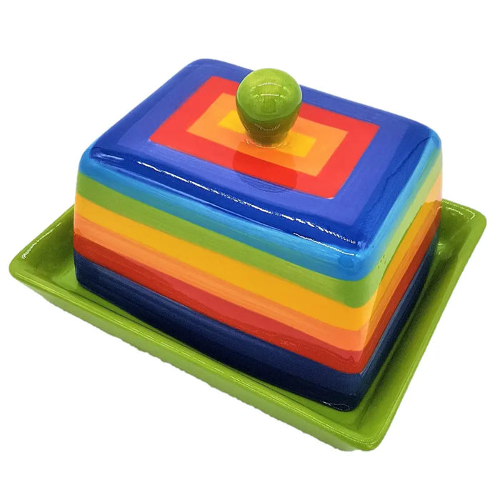 Vibrant rainbow striped ceramic butter dish with glossy green knob resting in matching lime green tray