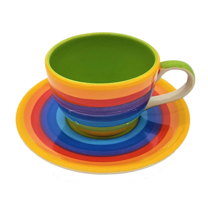 Rainbow ceramic coffee cup with green interior and matching saucer featuring rainbow stripes ceramic coffee cup design