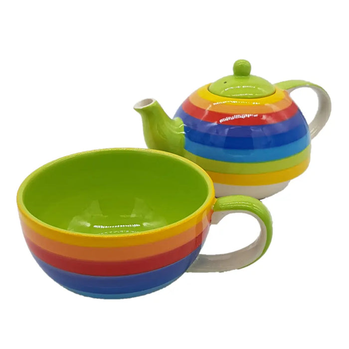 Rainbow-striped ceramic teapot set with green lid and handle paired with matching rainbow-striped ceramic cup bowl