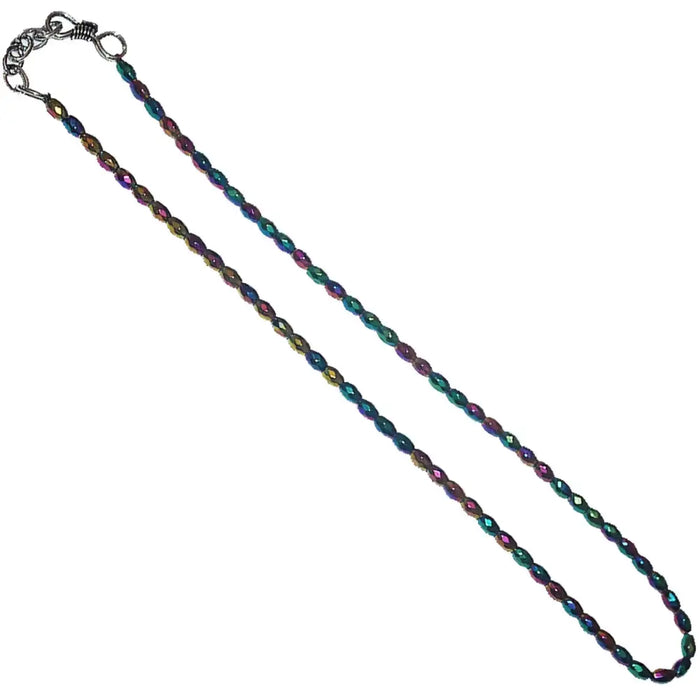 A delicate chain necklace with hematite faceted beads in shimmering green purple and gold hues