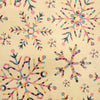 Beige recycled kraft wrapping paper with colorful pink blue yellow and black geometric snowflakes on kraft paper