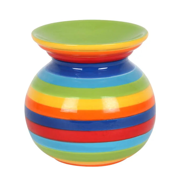 A round ceramic oil burner with vibrant concentric rainbow stripes in green yellow orange red and blue