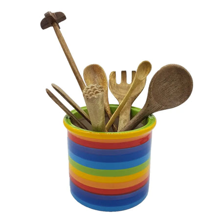 Rainbow-striped ceramic utensil jar filled with wooden cooking tools for kitchen countertop use