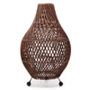 Brown woven natural rattan table lamp with teardrop shape and three black spherical feet with plug fitting