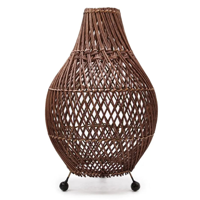 Brown woven natural rattan table lamp with teardrop shape and three black spherical feet with plug fitting