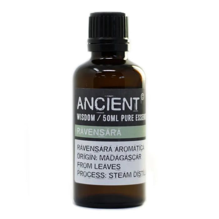 A dark amber glass bottle of ravensara essential oil 50ml with a black ribbed cap and a simple label design