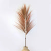A set of 3 rayung grass with tall coral copper-toned pampas plumes in woven natural fiber bases