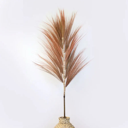 A set of 3 rayung grass with tall coral copper-toned pampas plumes in woven natural fiber bases