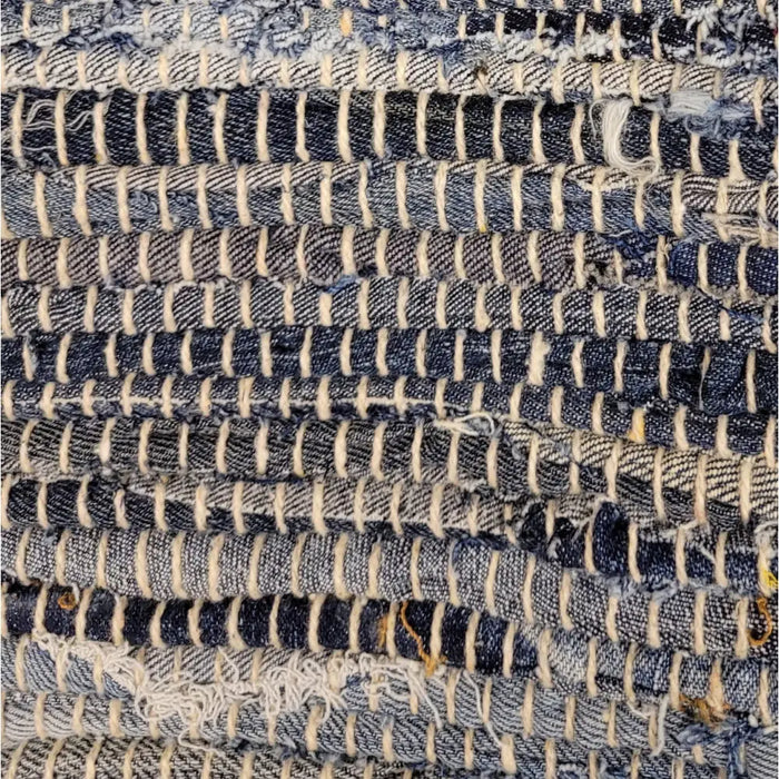 Blue and white denim strips woven into a textured chindi rag cushion cover for standard cushions