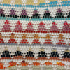Colorful recycled chindi rag cushion cover with geometric stacked triangles in red purple teal and orange for standard cushions