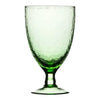 A translucent ice green recycled glass wine glass with a hammered texture and slender stem made from recycled glass