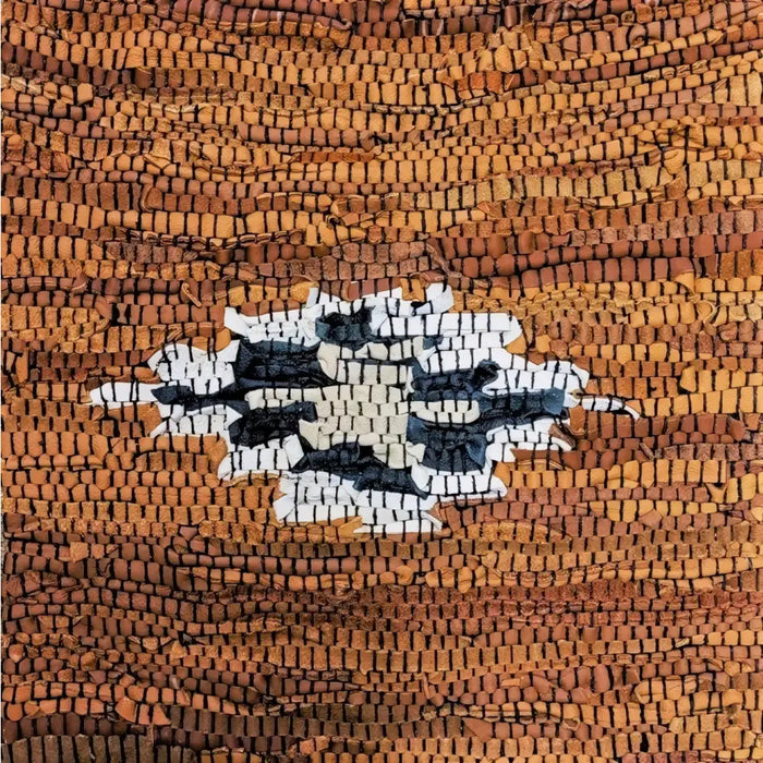 A recycled leather standard cushion cover with a fragmented ancient mosaic design in black white and earthy brown colors