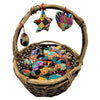 Woven wicker basket filled with colorful patchwork ornaments made from recycled sari silk hanging decorations