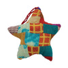 A colorful patchwork star ornament in red teal orange and blue made from recycled sari silk fabric hanging decoration
