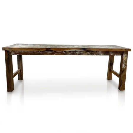 Rustic dining table with weathered reclaimed teakwood surface and sturdy dark brown legs for dining use