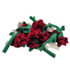A pile of red fabric roses with ruffled petals and green stems made from soft fabric for decorative use