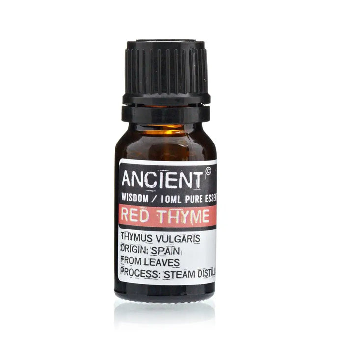 A small amber glass bottle with black cap labeled ancient wisdom red thyme essential oil from thymus vulgaris plant