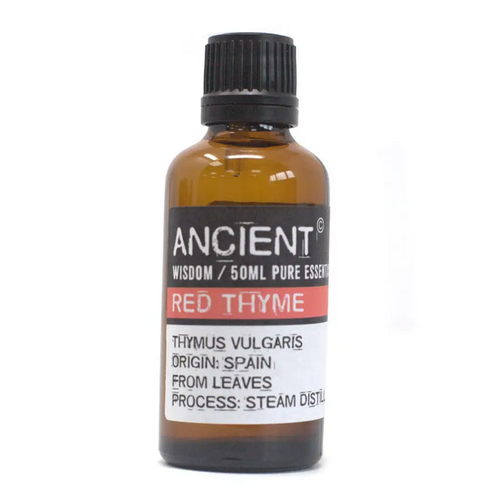 A 50ml amber glass bottle of red thyme essential oil with a black cap from the thymus vulgaris plant in spain