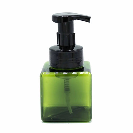 A sleek translucent green reusable foam dispenser bottle with a glossy black pump top 250ml capacity