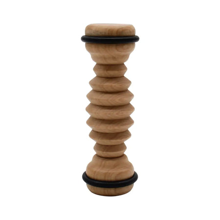 Light brown wooden ribbed foot roller with segmented spiral design and black rubber rings for foot massage