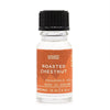 A clear glass bottle with a black cap and orange label of roasted chestnut fragrance oil with allergen declarations