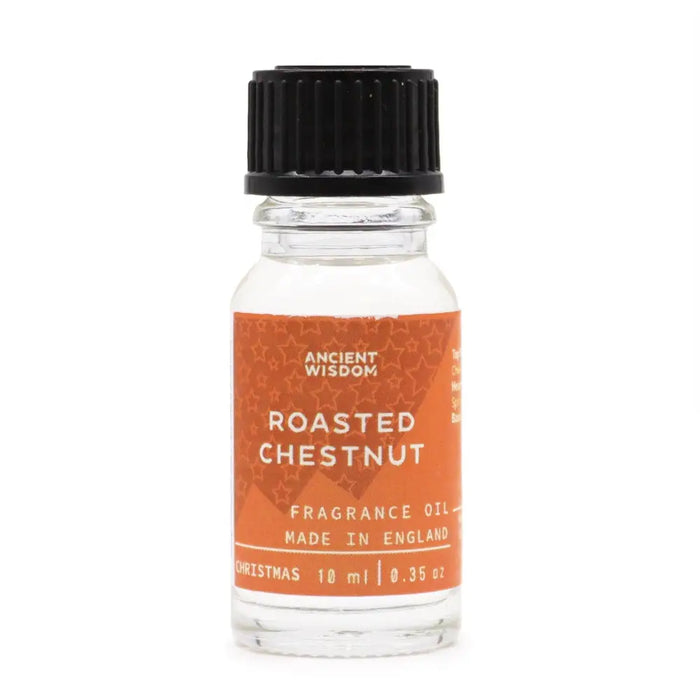 A clear glass bottle with a black cap and orange label of roasted chestnut fragrance oil with allergen declarations