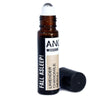 A brown glass roll on essential oil bottle with white cap labeled fall asleep with lavender chamomile and neroli oils