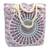 A canvas beach tote with a pink black and light blue mandala pattern and cream rope handles called rope-handled mandala bag electric blue