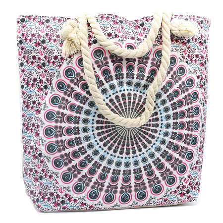 A canvas beach tote with a pink black and light blue mandala pattern and cream rope handles called rope-handled mandala bag electric blue