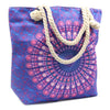 A canvas tote bag with a blue and pink mandala pattern and thick beige rope handles called rope handled mandala bag purple blue
