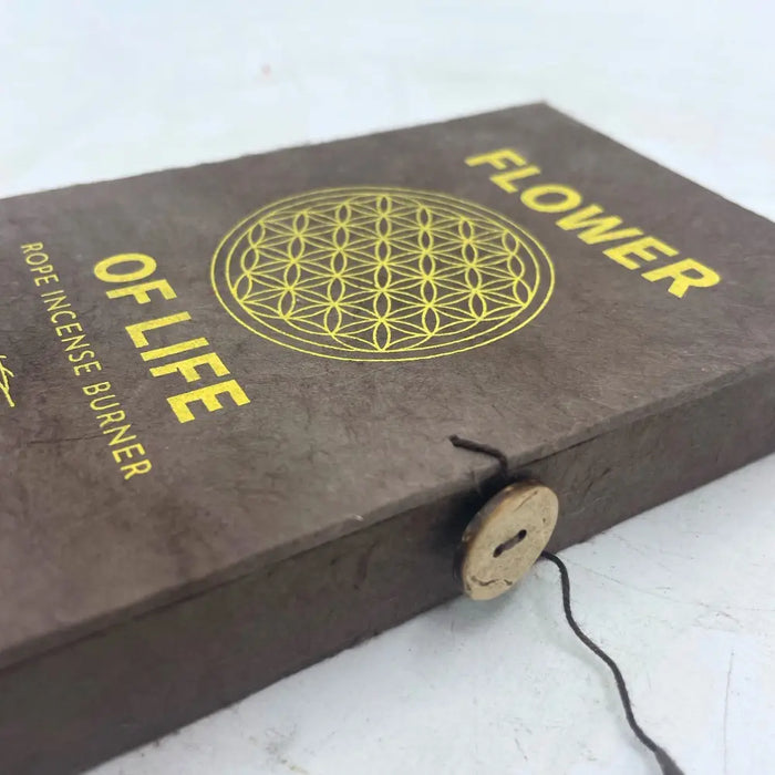 Brown textured rope incense burner box with gold foil flower of life lettering and circular geometric design