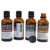 Four amber glass bottles with black caps of rose essential oil and other scents showing allergen declarations and therapeutic properties