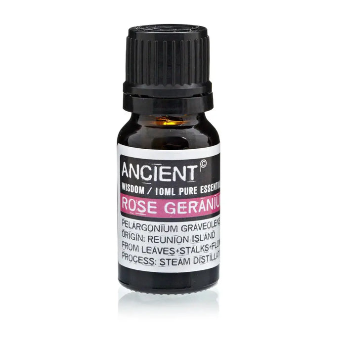 A small dark amber glass bottle of rose geranium essential oil with black cap and white label with pink text