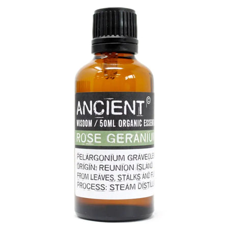 A 50ml amber glass bottle of ancient wisdom rose geranium organic essential oil with a black ribbed cap and green label