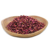 A light brown wooden bowl filled with deep magenta and burgundy dried rose petals weighing 0.5kg