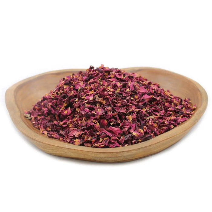 A light brown wooden bowl filled with deep magenta and burgundy dried rose petals weighing 0.5kg